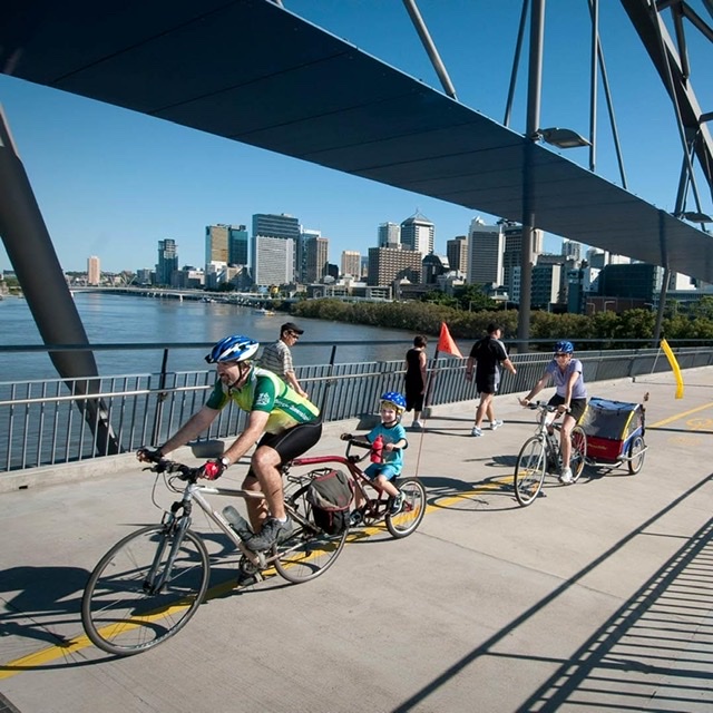 cycling city australia cyclists on a bridge in brisbane